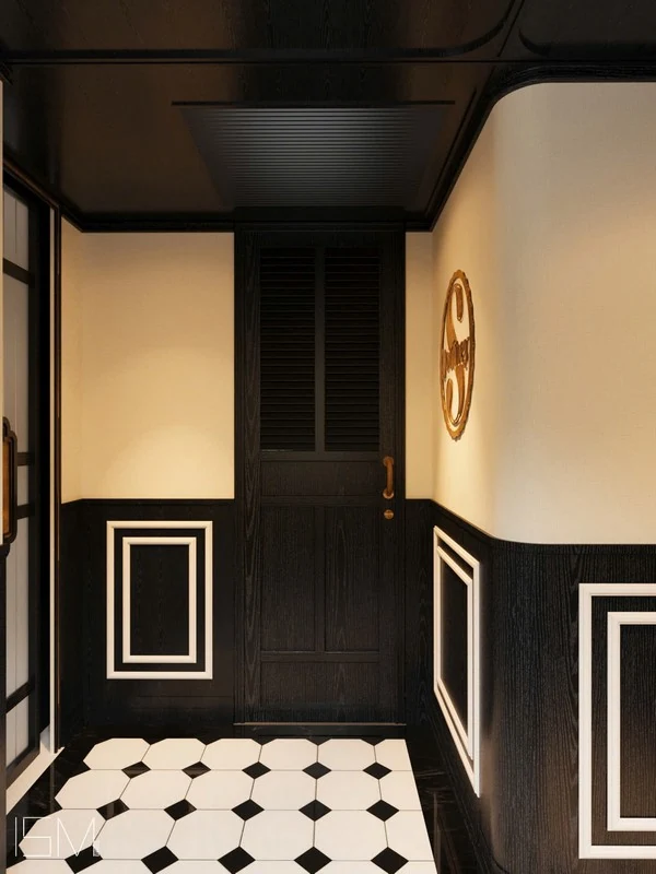 Imperial Suite SJourney Vietnam — entrée privée avec carrelage noir et blanc et logo SJourney doré